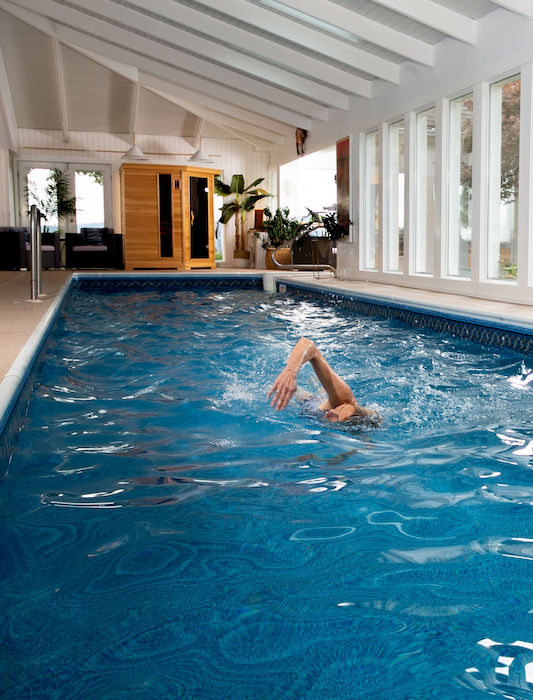 Woman doing laps in pool
