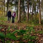 Two women walking in the woods